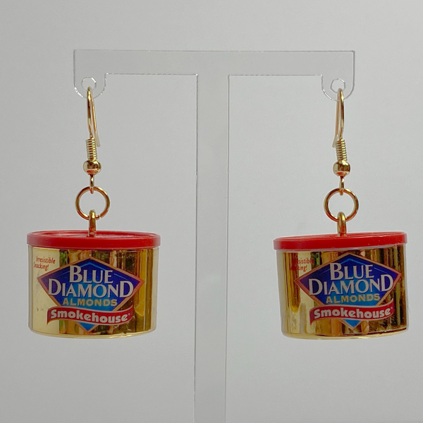 Mini gold Blue Diamond canned almond earrings on a white backdrop.