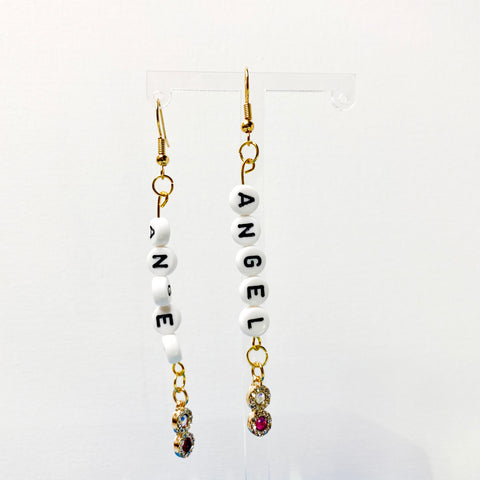 Hanging earrings with acrylic letter beads spelling angel with accent charms. 