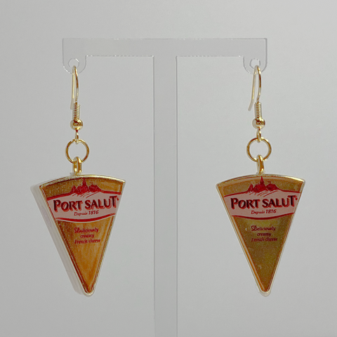 Mini gold Port Salut cheese earrings on a white backdrop. 