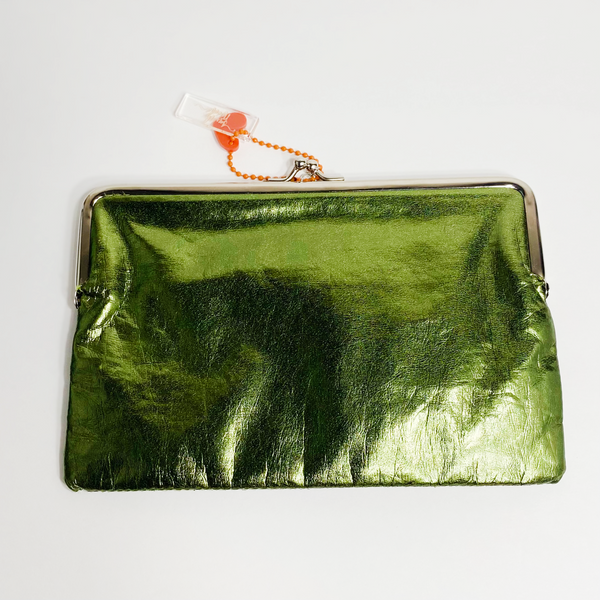 Shiny green clutch with silver accents. The purse is on a white backdrop. 