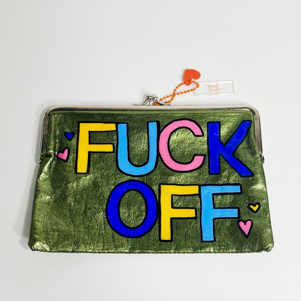 Shiny green clutch with silver accents and colored block letters spelling fuck off. The purse is on a white backdrop. 