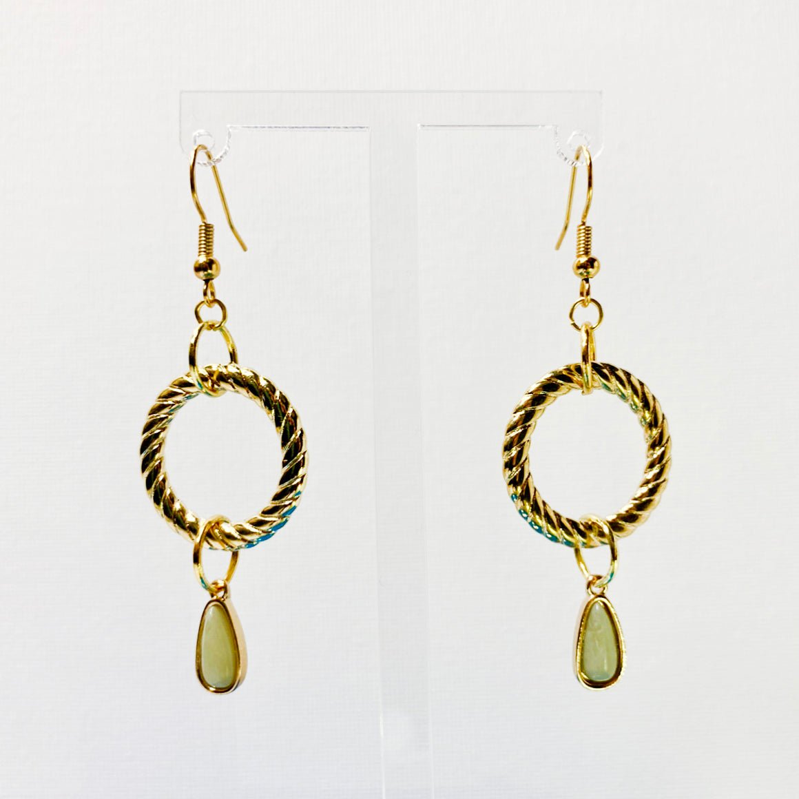 Hanging earrings with gold-plated hoop and tan teardrop gemstone.  