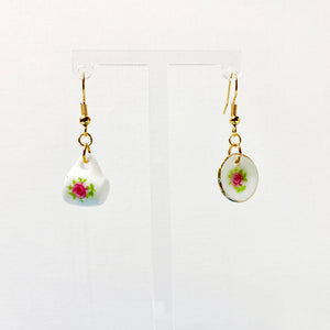 Hanging earrings with a mini plate and cup with floral decal accents. 